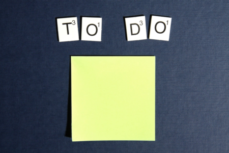 TO DO in scale letters with a blank post-it