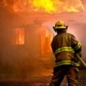Firefighter battling house fire