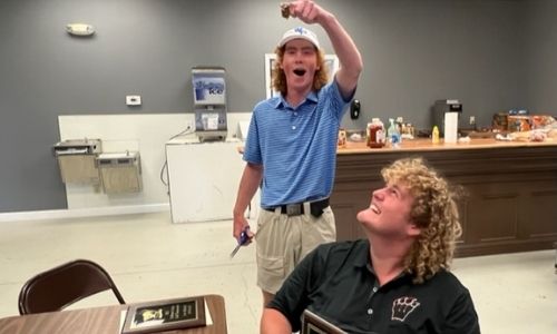County medalist Sawyer Edwards collects the payoff for his hair bet with Weaver’s Nick Ledbetter. The wager was the winner got to keep his mullet and the loser, well, got clipped.