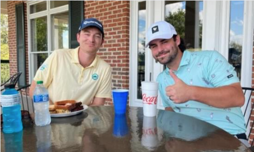 Cody Robinson (R) and Jack Stumpfig enjoy lunch after posting a 17-under-par 55 at Silver Lakes to take the Sunny King Classic first-round lead.