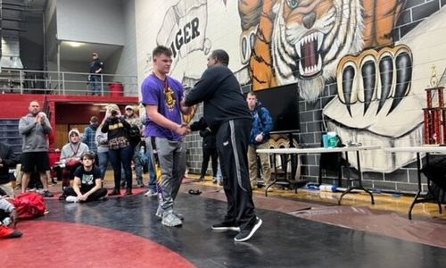 Ranburne heavyweight Carson Hall accepts a Best Match award at the Rumble in the Jungle. The Bulldogs will battle Dora for the State Duals title Friday.