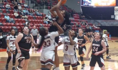 Ohatchee’s Jorda Crook goes up with a host of Anniston defenders around her during their Calhoun County semifinal Thursday in Pete Mathews Coliseum.