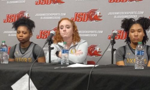 Oxford coach Melissa Bennett and players (from left) JaMea Gaston and Xai Whitfield talk to press after the Yellow Jackets’ loss to Huffman in Thursday’s Class 6A Northeast Regional semifinals.