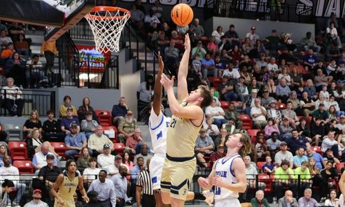 Ethan Duke goes up for two of his nine points against Etowah in Wednesday’s the Northeast Regional final in Pete Mathews Coliseum. (Photo by Greg Warren)