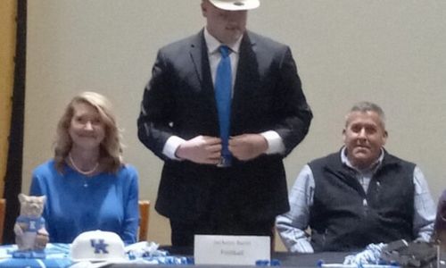 Oxford’s Jackson Bunn announces his decision to play football for the University of Kentucky during Wednesday’s National Signing Day ceremony in the Oxford High media center.