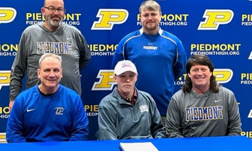 Receiver Thomas Propst celebrates signing to play at West Georgia with his Piedmont coaches. On the cover, Propst’s parents took part in the festivites.