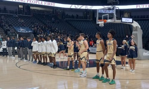 Defending Class 4A state champion Jacksonville lines up for introductions before playing Hale County in Tuesday’s state semifinals in Birmingham’s Legacy Arena. (Photo by Joe Medley)