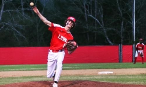 Munford’s Tanner Smith throws one of his 45 pitches in a perfect game against Talladega on Monday. (Submitted photo)