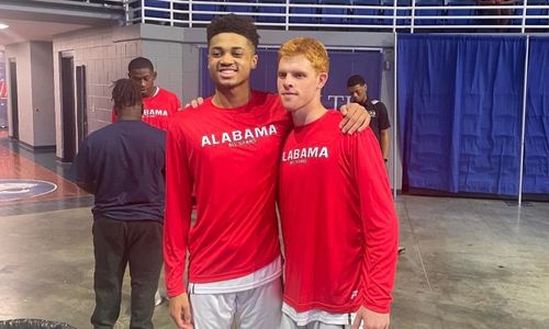 Jacksonville’s John Broom (left) and Piedmont’s Alex Odam celebrate after helping the Alabama All-Stars beat Mississippi 91-72 on Saturday. (Submitted photo)
