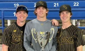 Roby Brooks, Sam Robertson and Hayes Harrison hold the championship trophy from the Perfect Game National High School Showdown on Saturday. (Submitted photo)