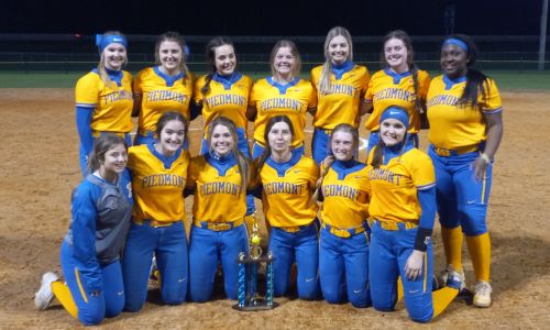 Piedmont poses with the trophy after winning the Lady Wildcat Classic. (Photo by Joe Medley)