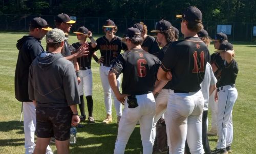 Donoho coach Steve Gendron delivers another happy postgame talk after the Falcons beat Sulligent 10-6 in the decisive Game 3 of their first-round Class 2A playoff series Saturday at home. (Photo by Joe Medley)