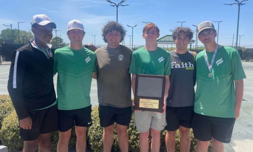 Faith Christian’s boys’ tennis team holds the prize for winning the Class 1A-3A Section 3 tournament Monday in Huntsville. (Submitted photo)
