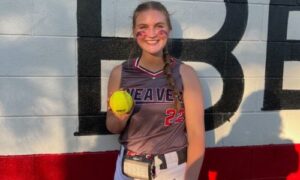 Weaver senior Madison Atchley holds the ball she hit for her first career home Wednesday. Weaver beat Gadsden City 15-0. (Submitted photo)