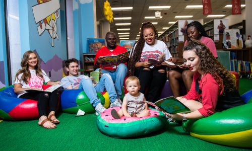 The JSU Ambassadors reading books in the Children's Corner of Houston Cole Library in summer 2021.