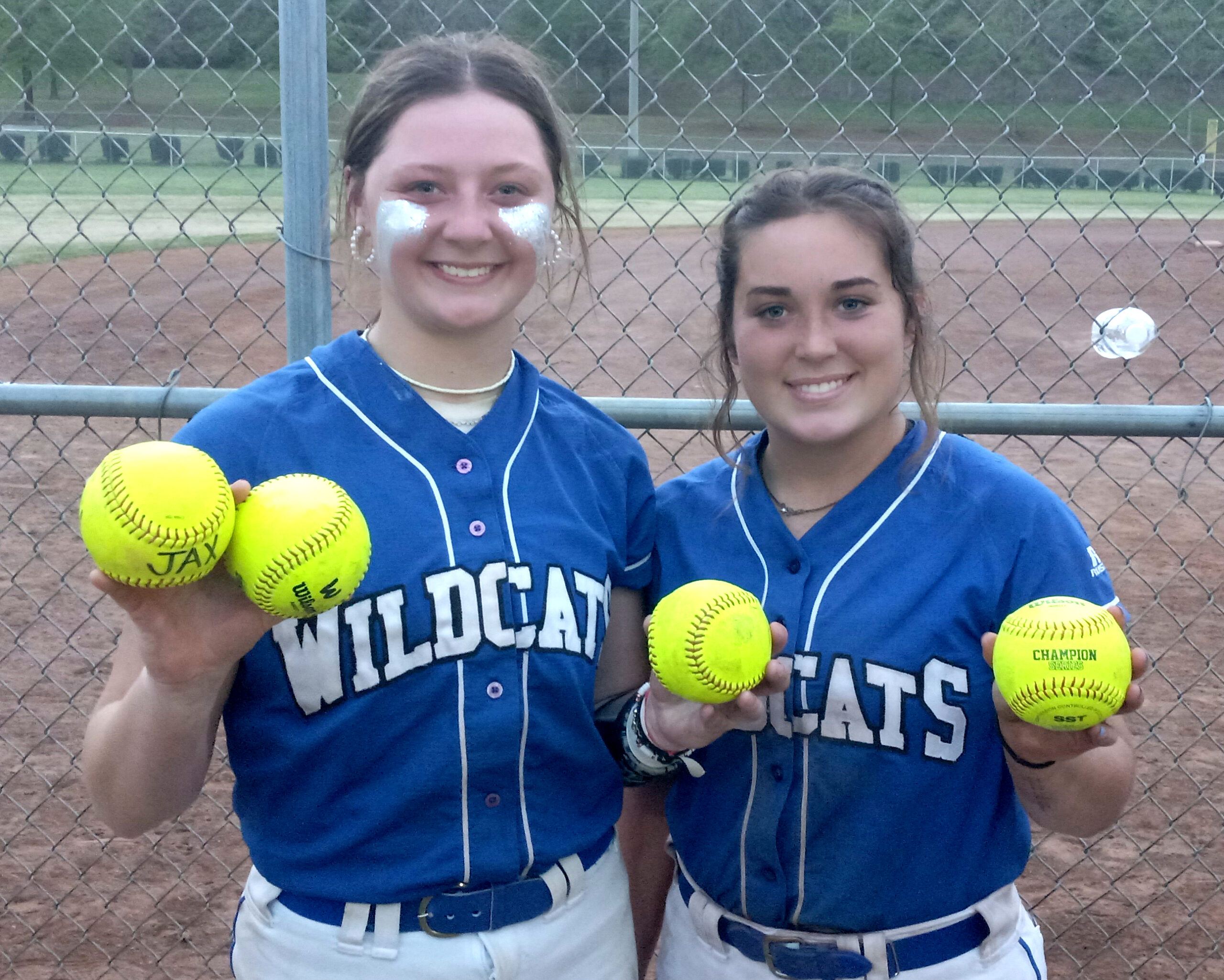 Leighton Arnold (left), pictured with White Plains teammate Callie Richardson, holds up three balls to mark the three home runs she hit in one day at the Calhoun County tournament. She led the state with 24 home runs on the season. In the circle, Arnold also struck out 255 batters with a 2.27 ERA. She is East Alabama Sports Today’s pick for Class 4A-6A All-Calhoun County player of the year. (Photo by Joe Medley)