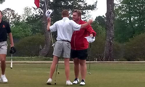 Weaver’s Nick Ledbetter (right) embraces friend and Calhoun County rival Sawyer Edwards after winning the county tournament at Pine Hill Country Club. Ledbetter won county with a two-round total of 139, eight strokes better than Edwards. Ledbetter also won sectional and sub-state and finished as state runner up in Class 3A for the second year in a row. Edwards took second at county, was low medalist at sectional and sub-state and finished third in Class 4A at state, shooting a two-day total of 149, 10 strokes better than Ledbetter over the same two days on the same course. They are East Alabama Sports Today’s All-Calhoun County co-players of the year for boys’ golf. (Photo by Joe Medley)