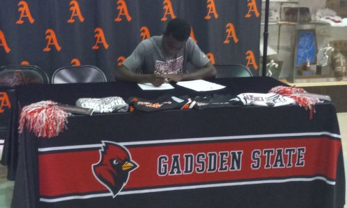 Alexandria’s DeShaun Foster signs Monday to run cross country for Gadsden State Community College. (Photo by Joe Medley)