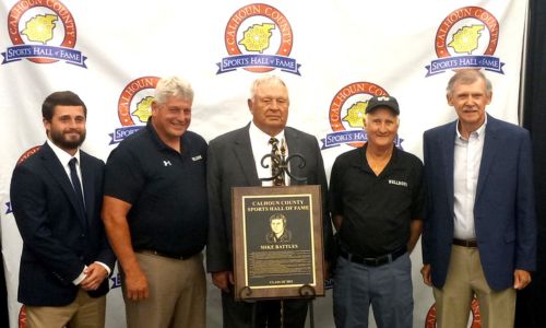 New Calhoun County Sports Hall of Fame inductee Mike Battles (center) poses with (from left) Judd Smith, Jeff Smith, David ‘Wormy’ Haynes and Chucky Miller during Saturday’s induction activities at the Oxford Civic Center. (Photo by Joe Medley)