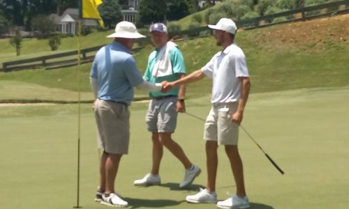 Jacob LeCroy (right) and Ty Cole (left) shake hands as Freeman Fite looks on after completing second-round play Saturday in the Wilfred Galbraith Invitational at Anniston Country Club. (Photo by Joe Medley)