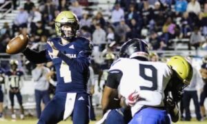 Jacksonville quarterback Jim Ogle looks to throw against Catholic Montgomery during the 2022 playoffs. The Troy commit enters his senior season with the Golden Eagles in 2023. (File photo)