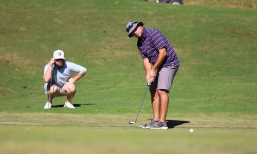 Jared Waits keeps an eye on partner Landon Winfrey’s putt during their first year together as Sunny King Charity Classic partners in 2021. (Photo by Brad Young)