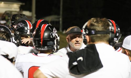 First-year Weaver coach Ken Cofer gives instruction during his team’s 40-13 victory over Donoho on Friday. (Photo by Greg Warren/For East Alabama Sports Today)