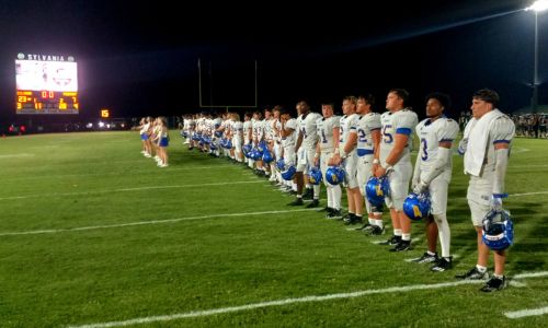 Piedmont’s football team lines up for the school’s alma mater after falling 23-7 at Sylvania on Friday. (Photo by Joe Medley)
