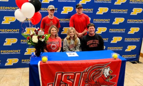 Savannah Smith poses for a picture with parents Rachel and Steve and brothers Sloan (standing, left) and Sean during Thursday’s ceremony to celebrate her signing to play softball for Jacksonville State University. (Photo by Joe Medley)