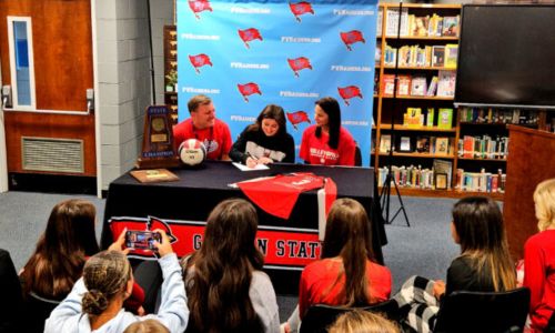 Pleasant Valley’s Allie Bryant on Tuesday celebrates her signing to play volleyball for Gadsden State Community College. (Photo by Joe Medley)