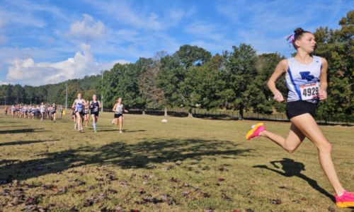 White Plains’ Maddyn Conn leads the field in the Calhoun County cross country meet in October. She’ll try to defend her 4A state championship Saturday in Moulton. (Photo by Joe Medley)