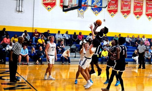 Anniston’s Delroy Francis goes up for two of his 19 points against Piedmont on Tuesday at Piedmont. (Photo by Joe Medley)