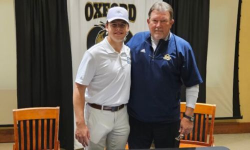 Oxford’s Brayden Cochran poses with Snead State Community College golf coach Sam Holcomb during Monday’s ceremony to celebrate Cochran’s signing. (Photo by Joe Medley)