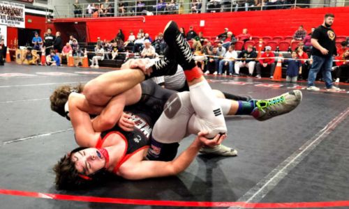 Within seconds, Weaver’s Hunter Hise went from this predicament to pinning Ranburne’s Zack Buchanan in third period of Saturday’s 177-pound final in Cleburne County’s annual Rumble in the Jungle. Hise rallied from a 7-1 deficit to help Weaver win the team title. (Photo by Joe Medley)