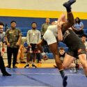 Weaver’s Brandon Jolliff throws Dora’s Korion Pryor to the mat during their Piedmont Dogfight 217-pound final Saturday at Piedmont High School. (Photos by Joe Medley)