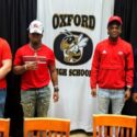 Oxford’s Andrew Kirkland (left), Jaydon Thomas, Camare Hampton and Donovan Jones pose for pictures after Oxford’s National Signing Day ceremony Wednesday. (Photo by Joe Medley)