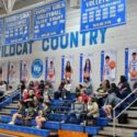 Banners honoring 13 senior basketball players line the wall behind the visiting bleachers at White Plains High School. (Photo by Joe Medley)