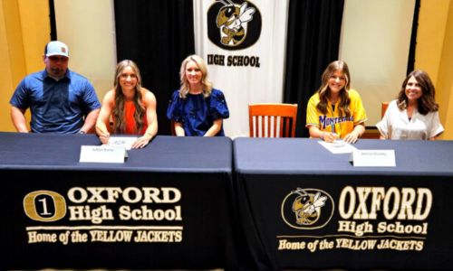 Oxford’s Ashlyn Burns (left) and Berkley Mooney celebrated their college signings at Monday’s ceremony in the Oxford High School media center. Burns will play for Wallace State Community College and Mooney for the University of Montevallo. (Photo by Joe Medley)