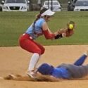 Piedmont’s Savannah Smith slides head first into third base with a triple that set up the game-winning run as the Bulldogs advanced 3-2 against Pleasant Valley on Monday at Choccolocco Park. (Photo by Joe Medley)