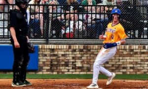 Piedmont’s Jacob McElroy scores a run during the Bulldogs’ first-round playoff series against Sylvania on Thursday. Piedmont advanced to face Fayette County, starting Thursday. (Photo by Joe Medley)