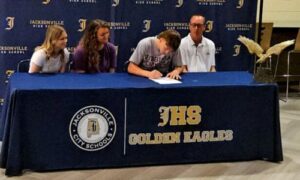 Jacksonville’s Cole Guthrie signs Thursday to play baseball for Virginia Peninsula Community College. (Photo by Joe Medley)
