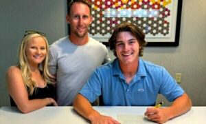 Former Oxford High standout Hayes Harrison (right), the 2023 Alabama Mr. Baseball and Gatorade player of the year for Alabama, signs Wednesday to play summer ball for the Choccolocco Monsters. The team also announced Etowah High assistant coach Ricky Clayton (center) as its head coach. Also pictured: Kaleigh Clayton, Ricky’s wife. (Submitted photo)