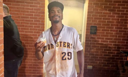 Choccolocco Monsters center fielder Rashad Robinson, set to transfer to Jacksonville State, celebrates his walk-off heroics and 21st birth with a cupcake Friday at Choccolocco Park.