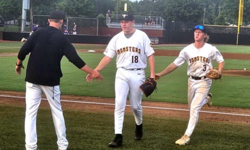 Choccolocco Monsters pitcher Andrew Allen is congratulated by Monsters coach Ricky Ray Clayton and teammate Huge Windle in the first inning of Friday’s Game 1 of the Monsters’ semifinal series against the Cartersville Cannons. (Photo by Joe Medley)