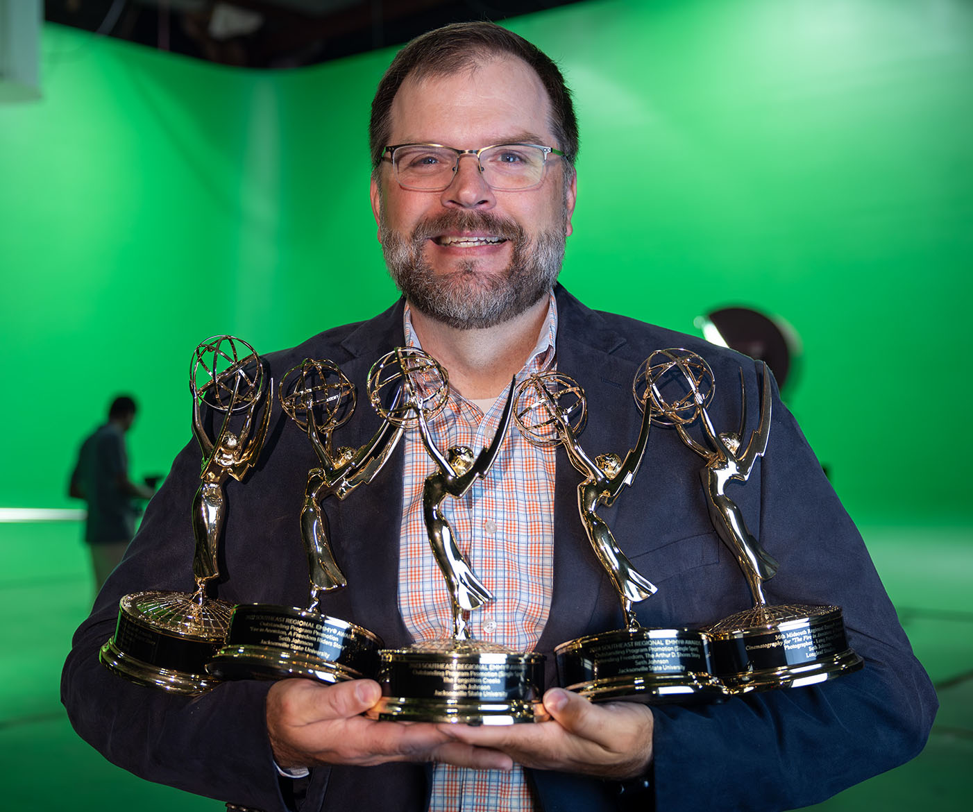 Seth Johnson holding 5 Emmys Photo Courtesy of JSU