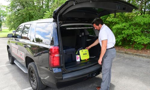 AED-Narcan 2: Chief Jay Freeman puts a new AED and Narcan in a Gadsden State police cruiser. Equipping all Gadsden State security vehicles with an AED and Narcan is just one of many accomplishments the chief has achieved during his first year of service.