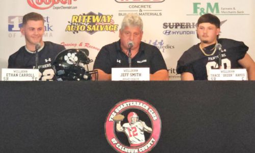 Wellborn players Ethan Carroll (left) and Trace ‘Dozer’ Hayes flank Panthers head coach Jeff Smith during Friday’s Calhoun County Quarterback Club high school football media day at Anniston Country Club. (Photo by Joe Medley)