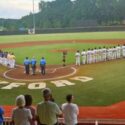 A day after Independence Day, the Choccolocco Monsters (right) and Cartersville Cannons line up for the National Anthem before their game Friday at Choccolocco Park. (Photo by Joe Medley)