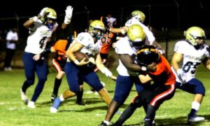 With a veteran offensive line clearing the way, Jacksonville quarterback Jackson Bonner runs for yardage at Alexandria on Friday (Photo by Greg Warren/For East Alabama Sports Today)