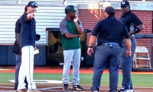 Choccolocco Monsters coach Ricky Ray Clayton points during a pregame meeting with umpires in June at Choccolocco Park. He is the Sunbelt League’s coach of the year, the league announced Friday. (Photo by Joe Medley)